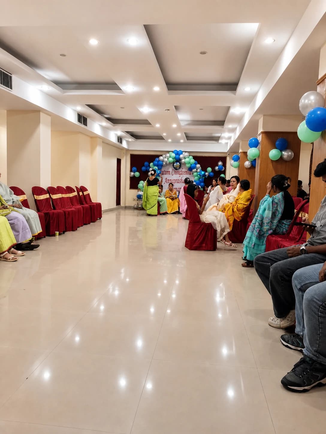 Banquet hall arranged for Annaprashan and family social celebration with balloon decor