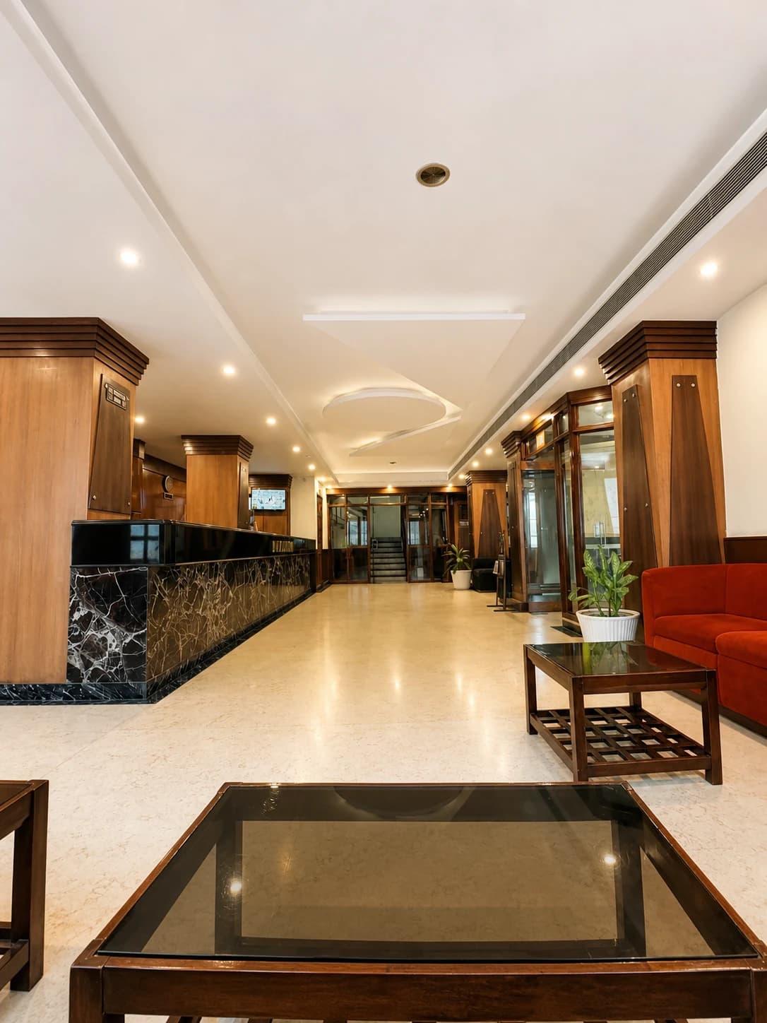 Well lit hotel corridor leading to guest rooms